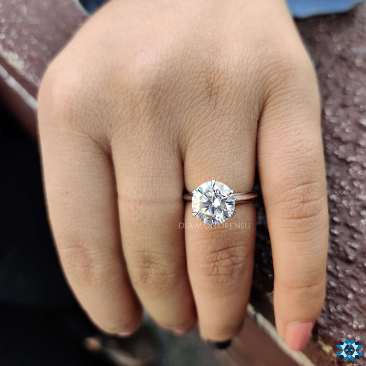 Handmade custom moissanite engagement ring in white gold.
