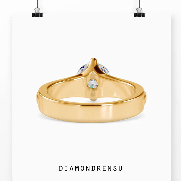 Simple diamond ring crafted in rose gold with a designer touch.
