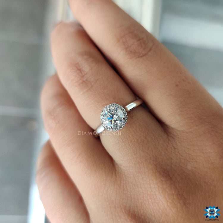 Moissanite ring with 4 prong halo setting.
