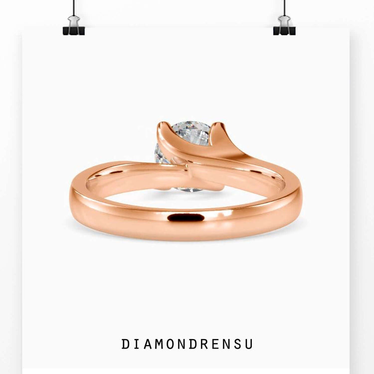 Handmade bypass ring featuring lab diamond solitaire.
