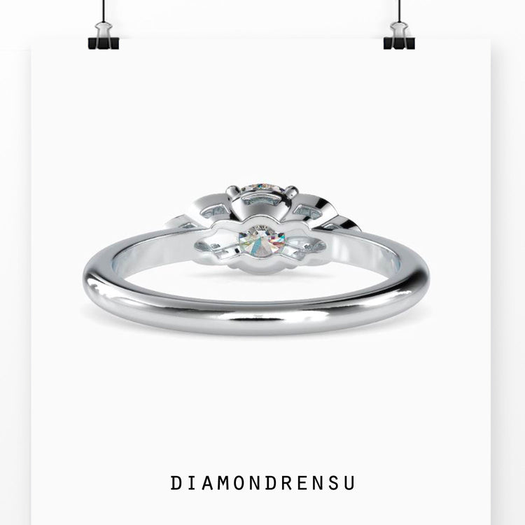 IGI certified diamond ring with round cut stones and four prongs.
