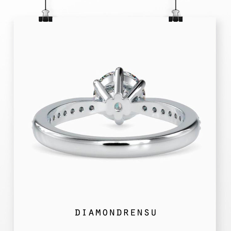 UK engagement ring with handmade tapered pave diamond band.
