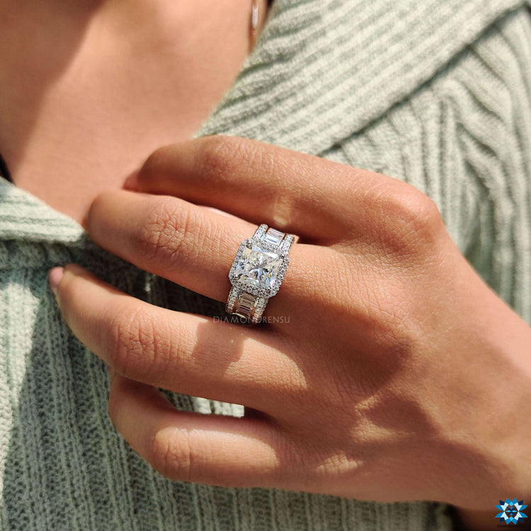 Radiant cut moissanite ring featuring a 3 row pave band.
