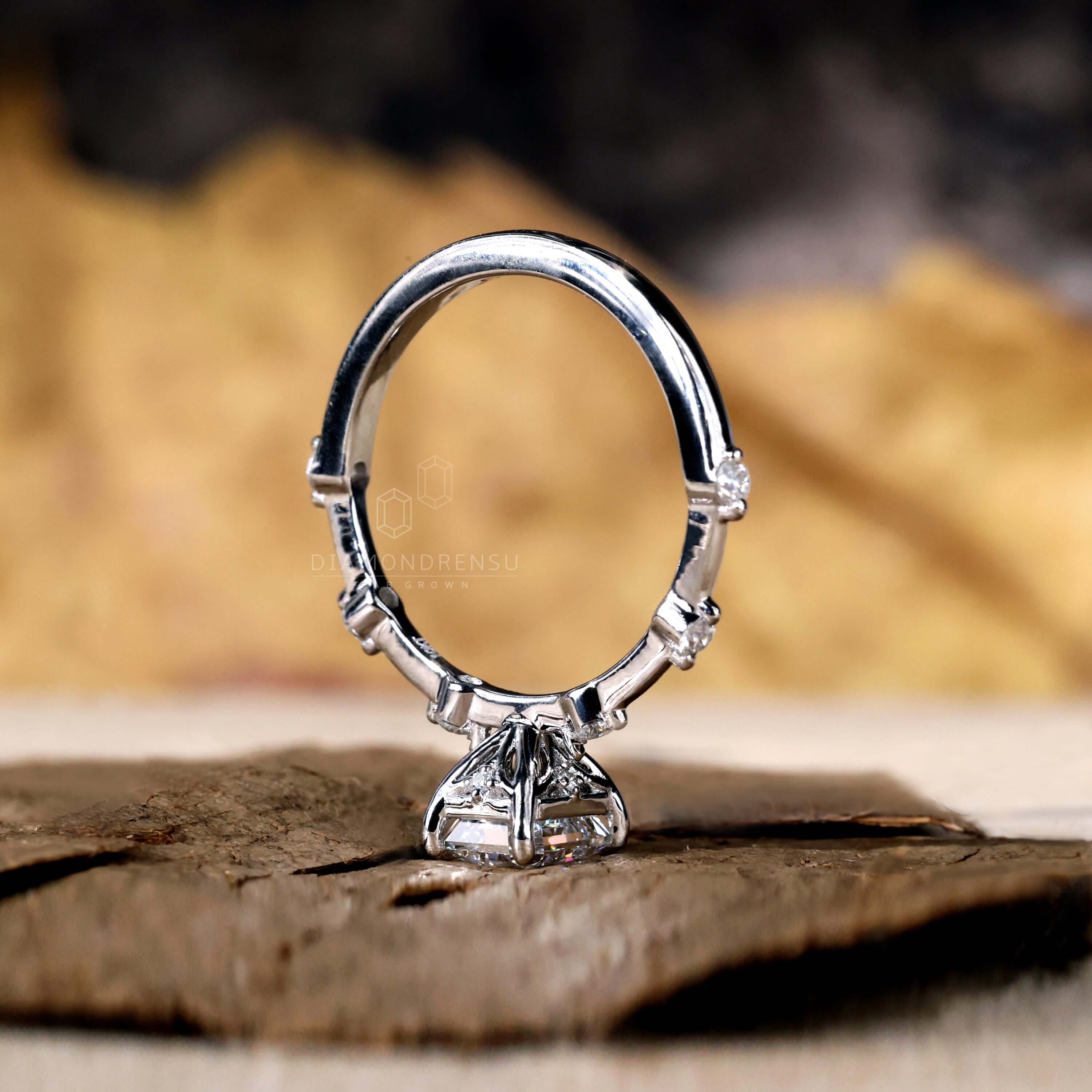 Radiant cut ring with brilliant diamonds, perfect for engagement celebrations.