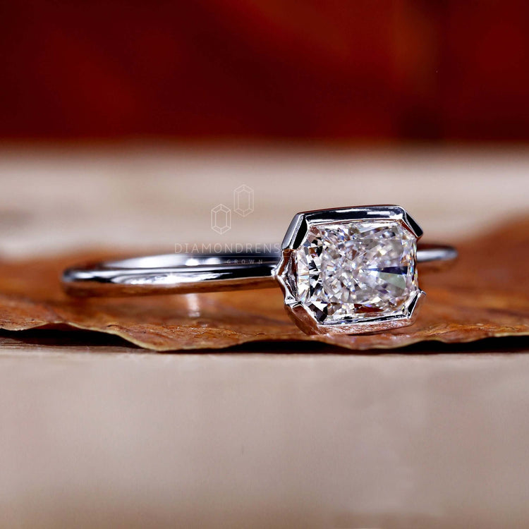 Radiant cut diamond ring with a half bezel design, perfect as a unique engagement ring for women.

