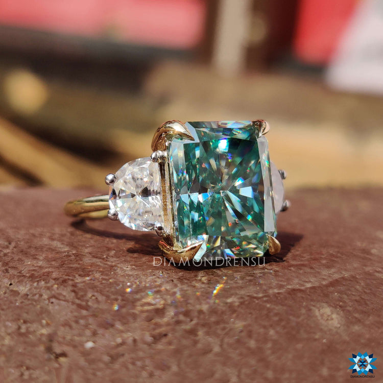 Cyan blue moissanite ring in a prong claw setting.
