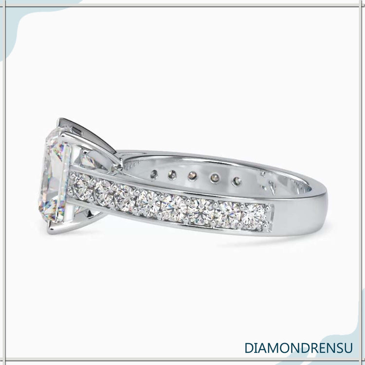 Round cut pave band in rose gold with tab prong setting.
