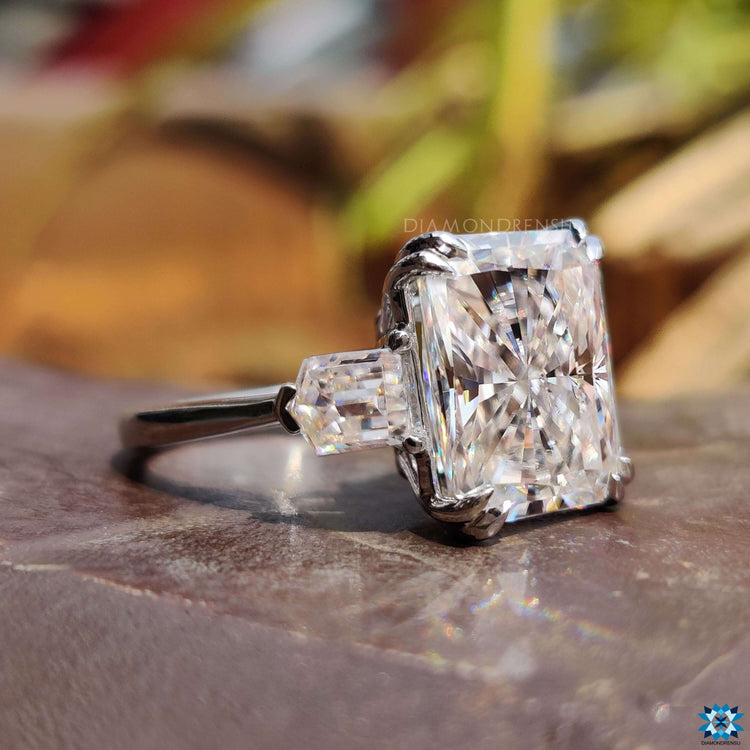 Custom moissanite ring with radiant center and tapered accents.
