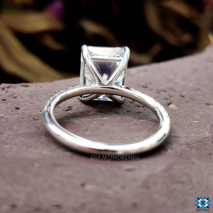 Custom white gold ring with radiant cut moissanite.
