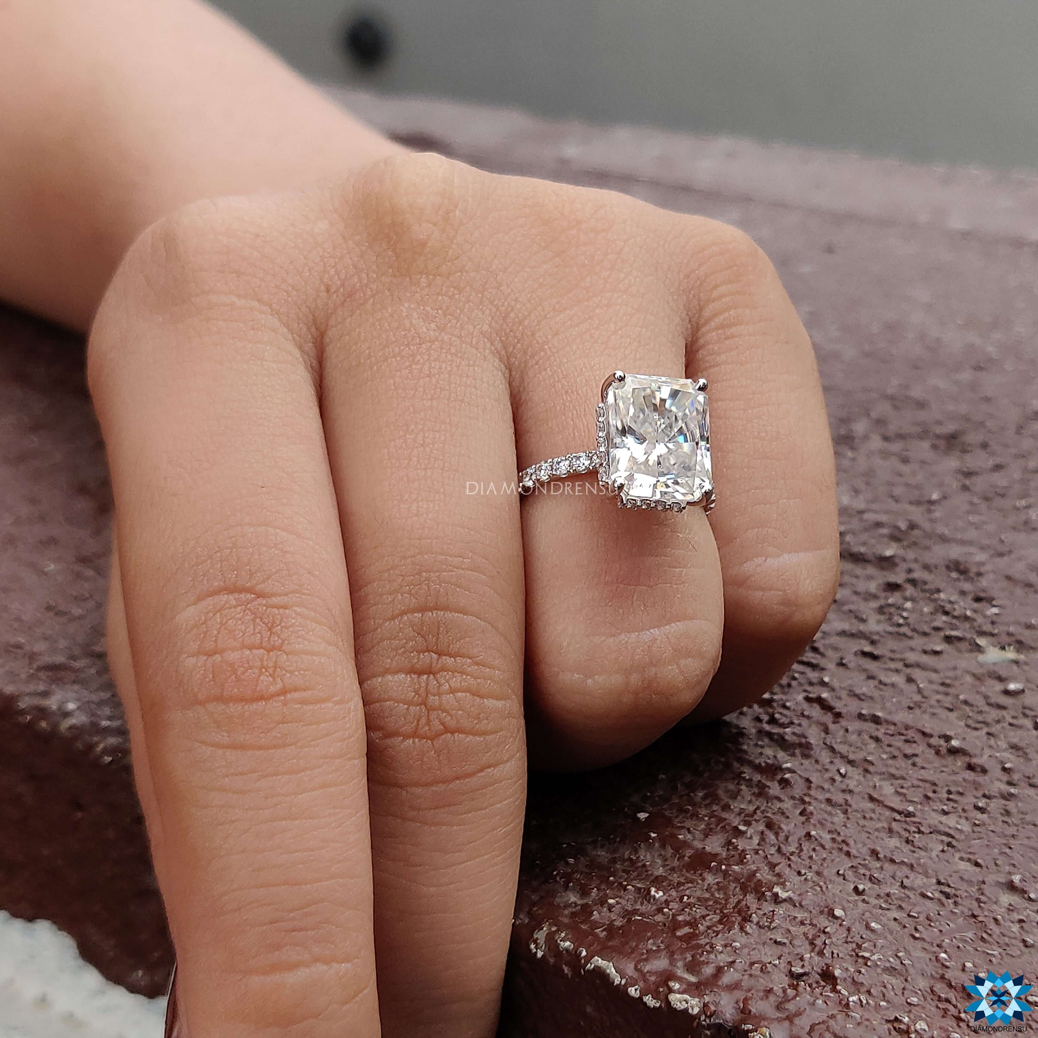 Hidden halo moissanite ring with a radiant cut centre stone.