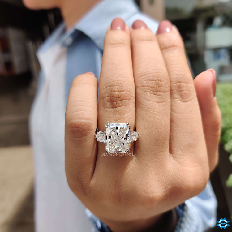Elegant white gold ring with radiant cut and tapered bullets.
