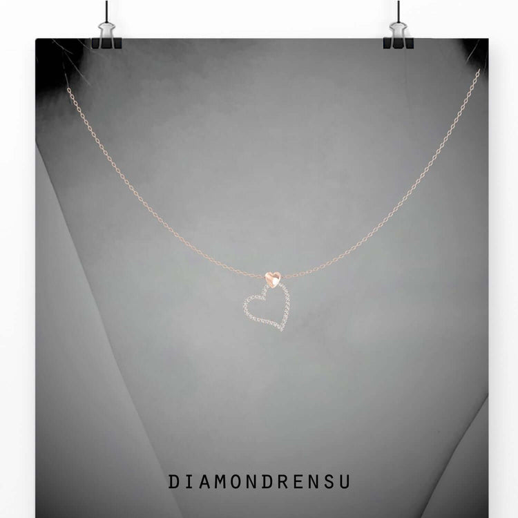 Heart shaped pendant crafted in rose gold with lab grown diamond.
