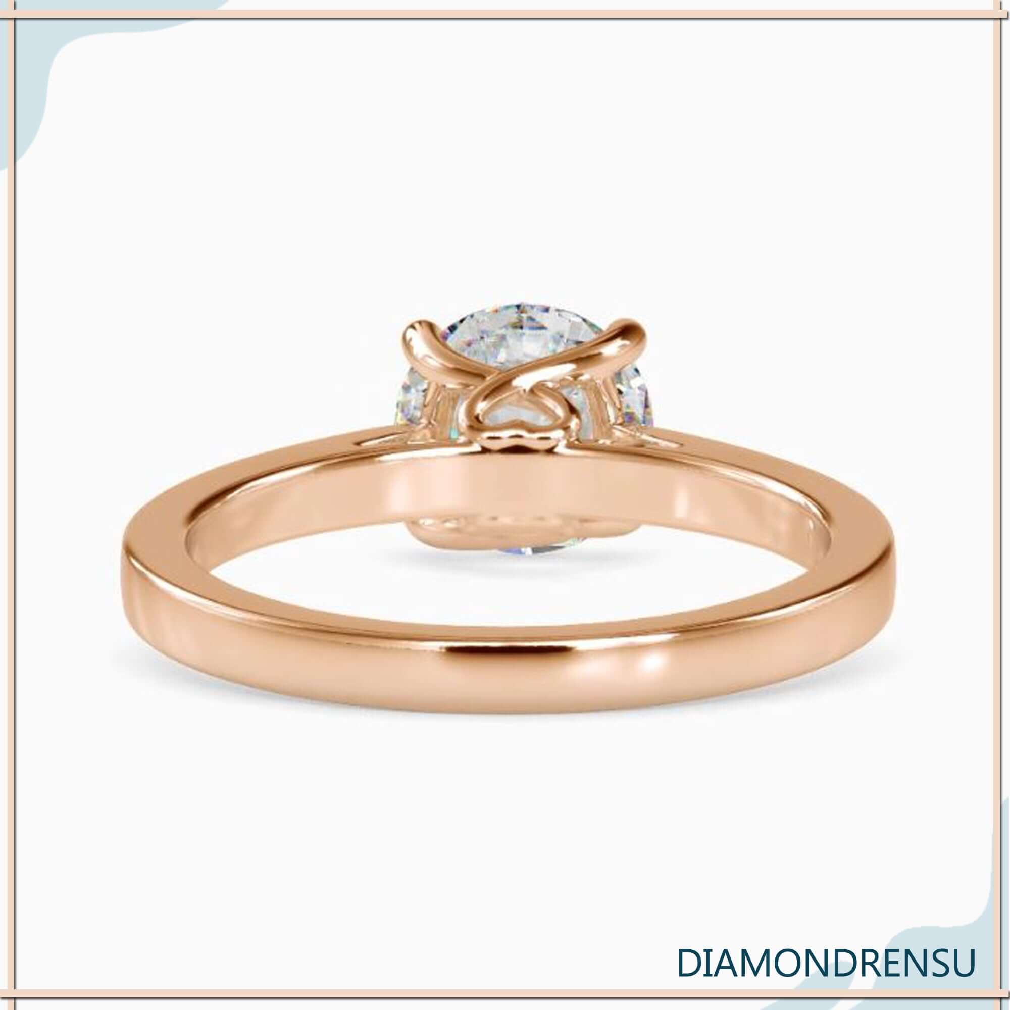 Handmade diamondrensu engagement ring in a stunning round solitaire design.