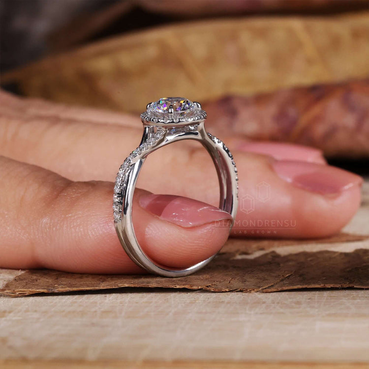 Round diamond engagement ring with a claw prong setting.
