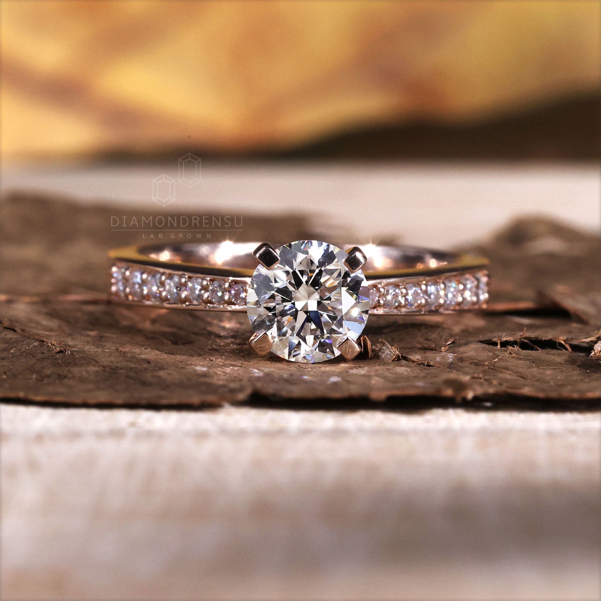 Brilliant round cut diamond ring with tab prongs for secure elegance.