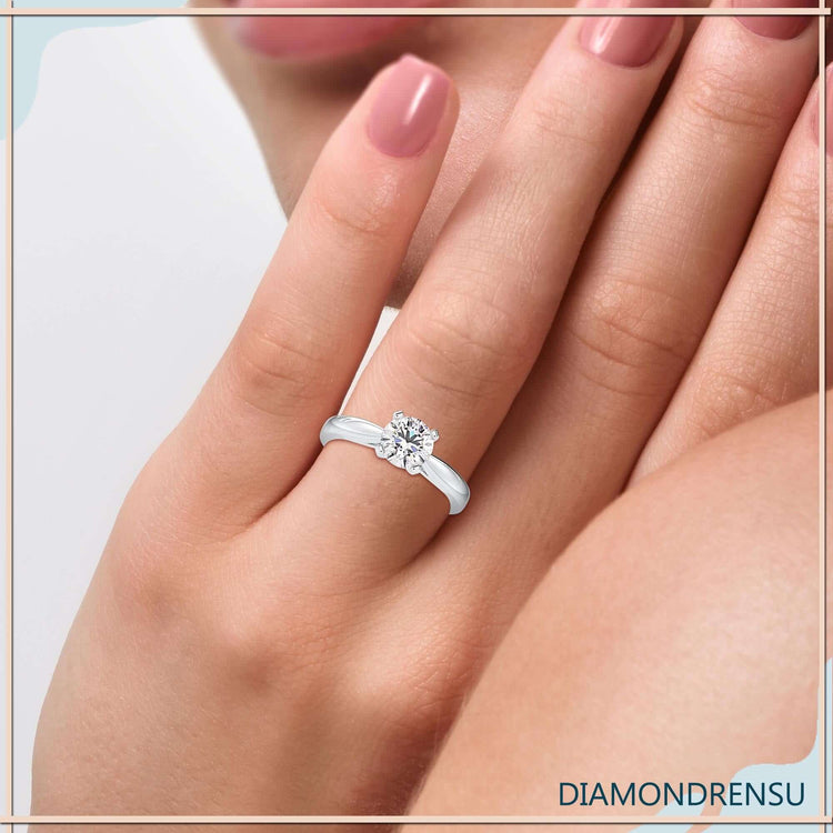 Solitaire diamond ring set in white gold band.

