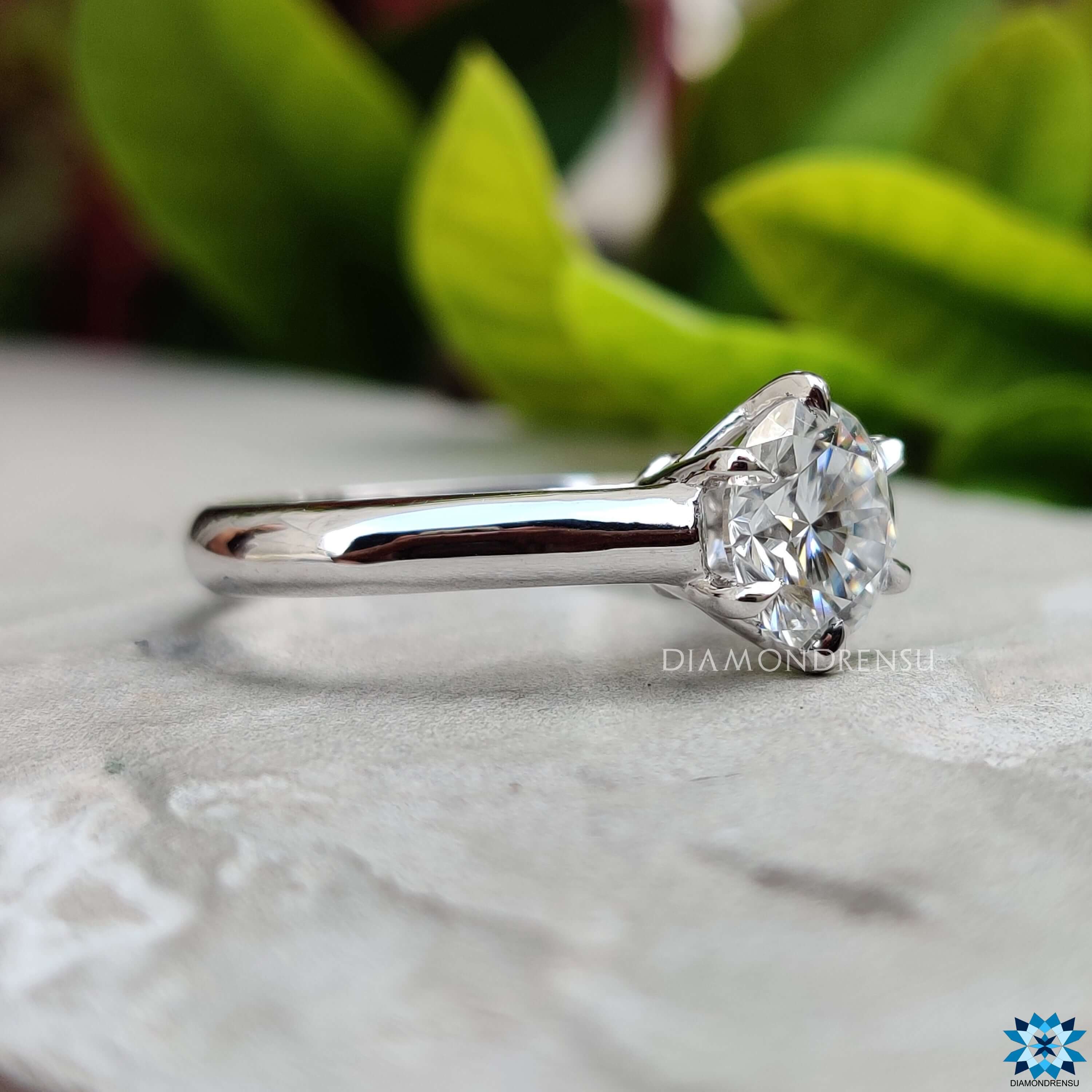 Round Cut Moissanite with brilliant sparkle.