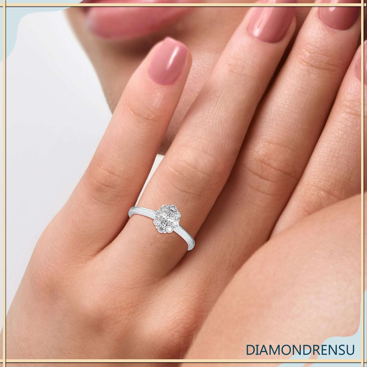 Oval diamond engagement ring with round cut halo setting.
