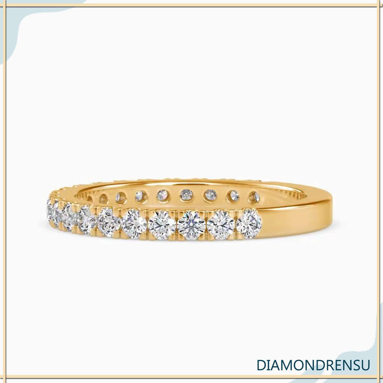 Round cut diamond band crafted in gold with 3/4 setting.
