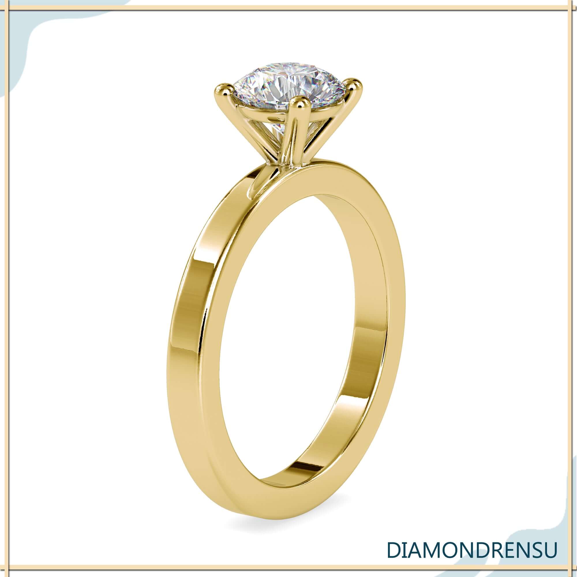 Round lab grown diamond engagement ring with a delicate basket setting.