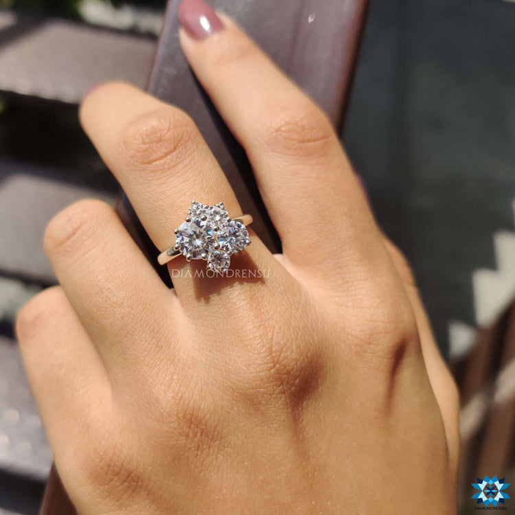 Custom engagement ring with round cut moissanite set in prongs.
