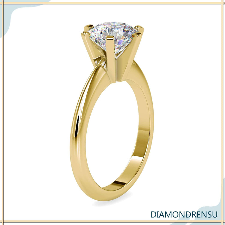 Solitaire diamond engagement ring with lab grown round cut stone.

