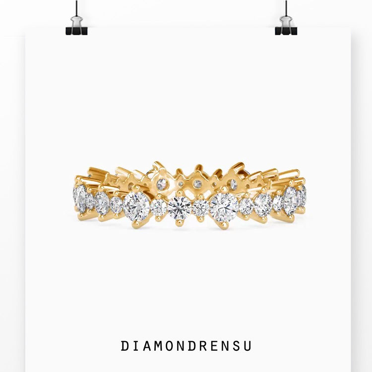 Gold wedding band featuring full circle round cut diamonds.
