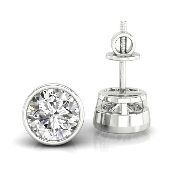 Bezel set round diamond stud earrings in white gold.
