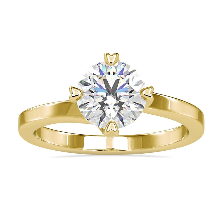 Gold round engagement ring with heart prong setting, handmade in the UK.
