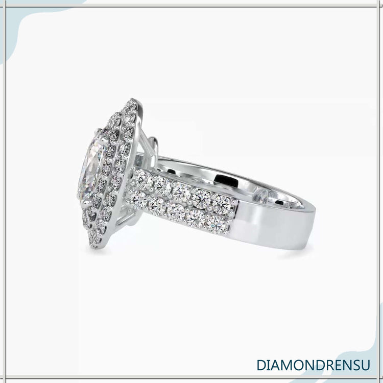 Lab diamond ring with four prong oval and pave accents.
