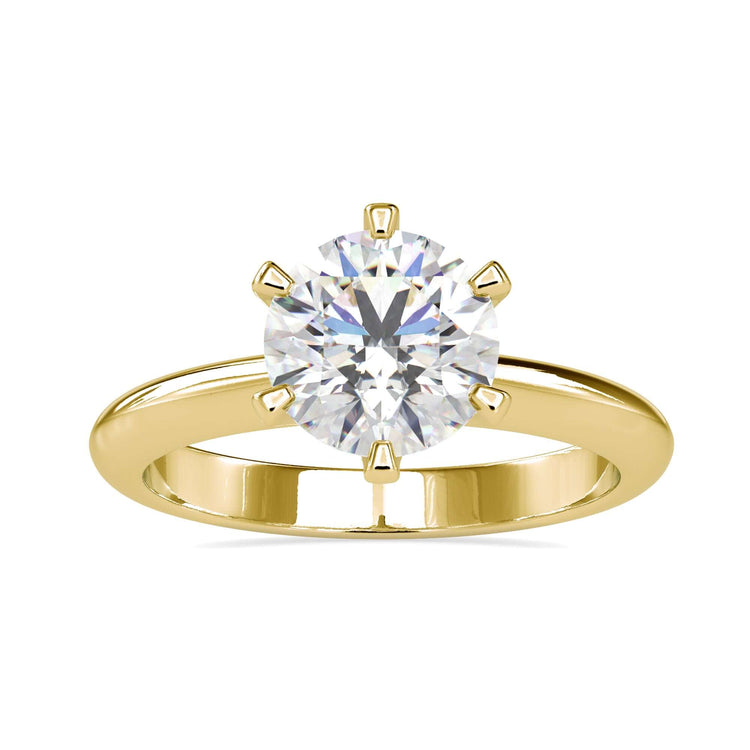 Round solitaire engagement ring in yellow gold.

