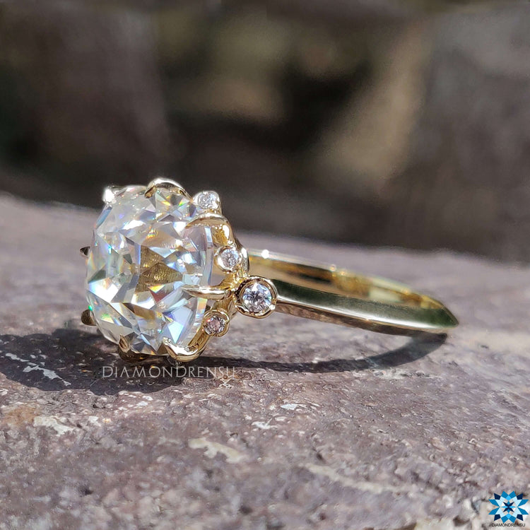 Yellow gold engagement ring with cushion old mine cut center.
