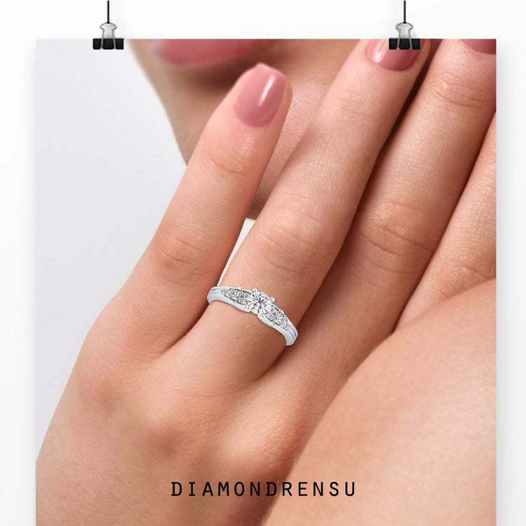 7 stone engagement ring with brilliant cut diamonds and round prongs.

