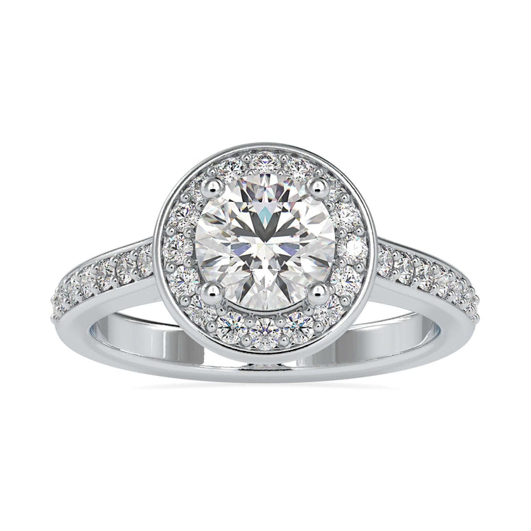UK diamond ring with round cut centre and white gold halo.
