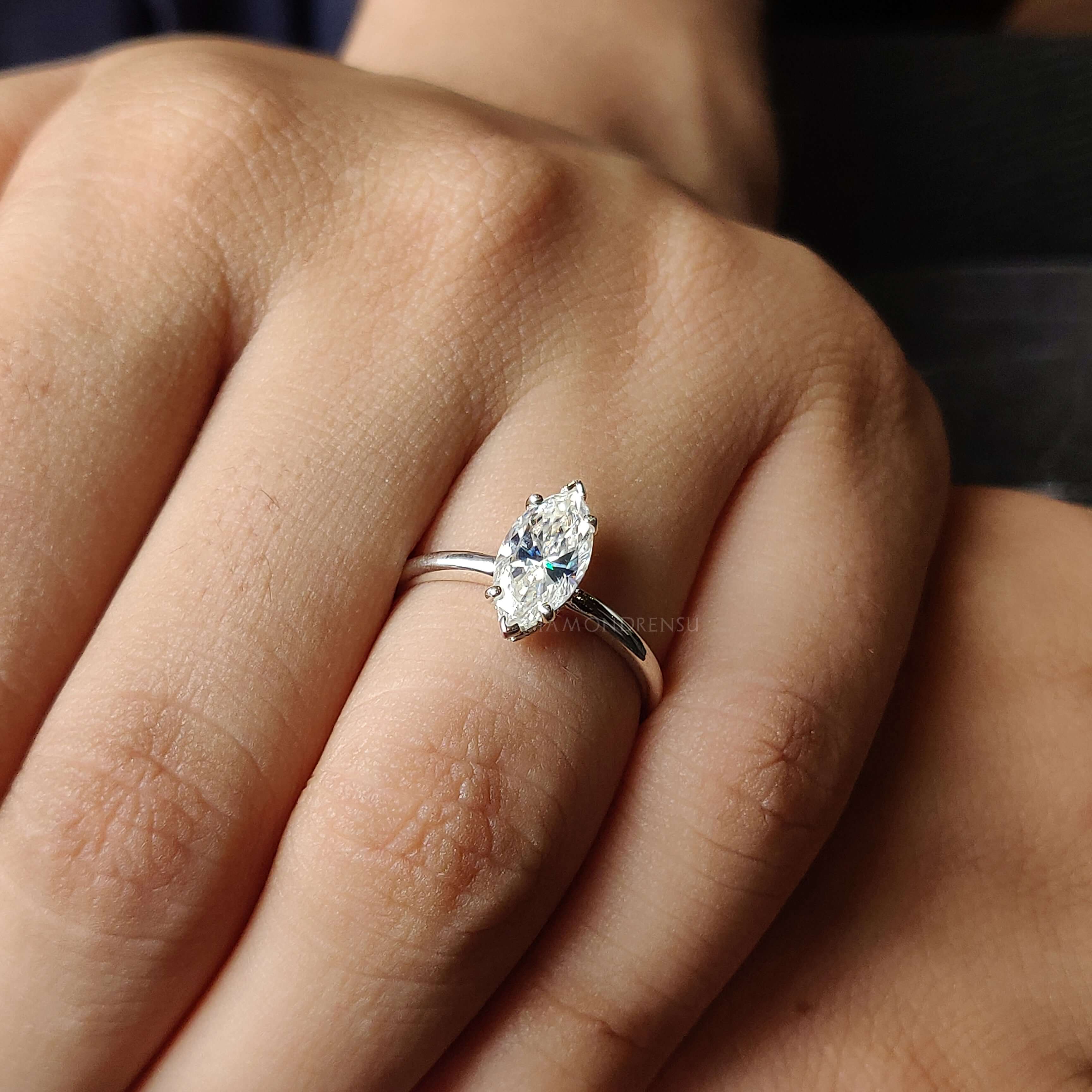 A moissanite solitaire ring with a brilliant marquise cut, perfect for modern engagement styles.