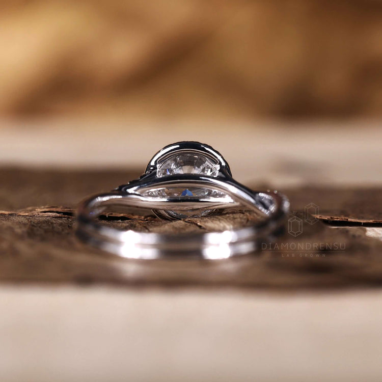 Halo diamond ring with a twisted band for a unique look.
