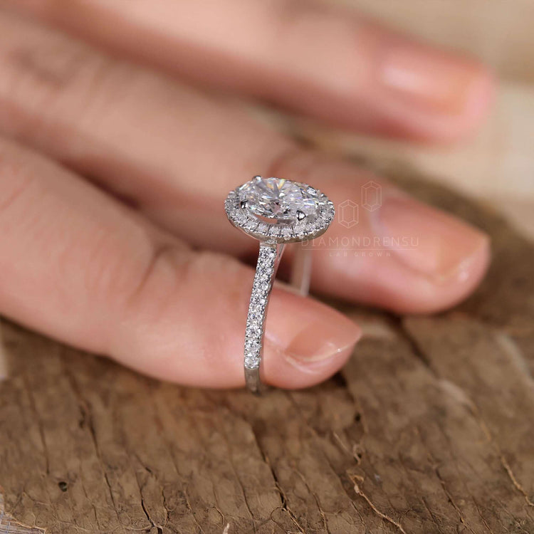 3 carat oval diamond ring in a halo design for timeless sparkle.
