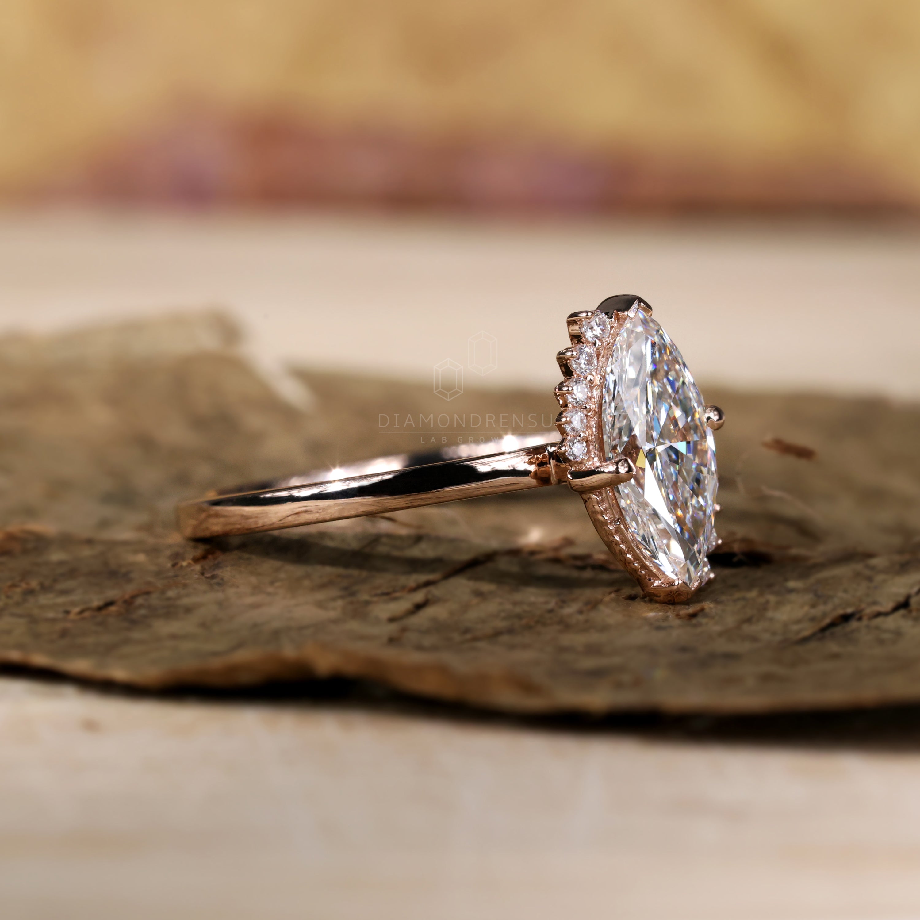 Marquise cut diamond in a delicate halo ring setting.