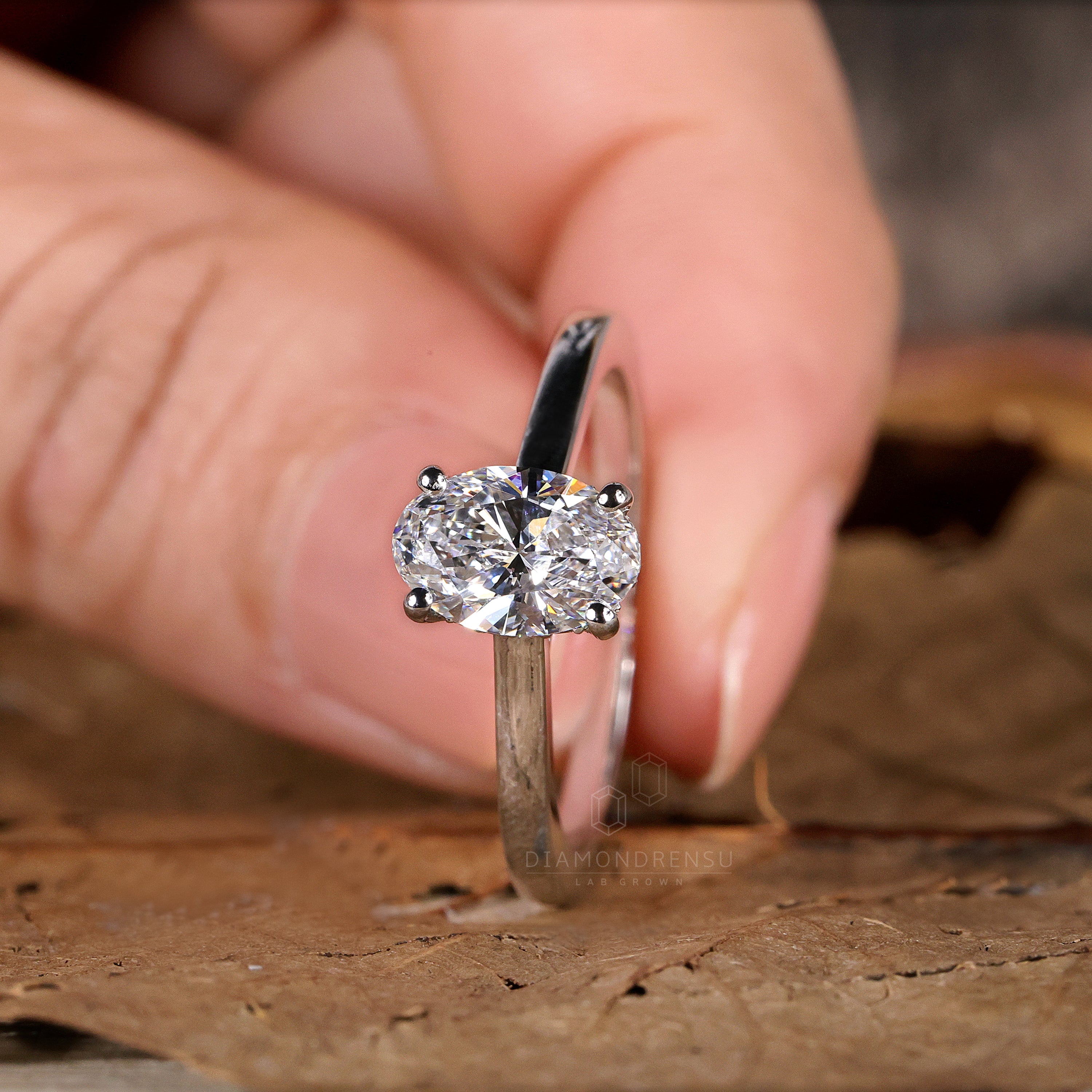 Cathedral setting oval engagement ring for a sleek look.