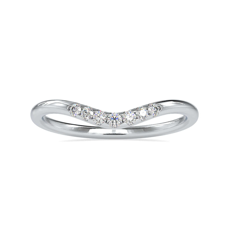 Curved wedding band crafted with round cut diamonds.
