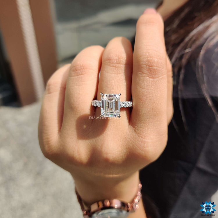 Hidden halo moissanite ring with round cut accents.
