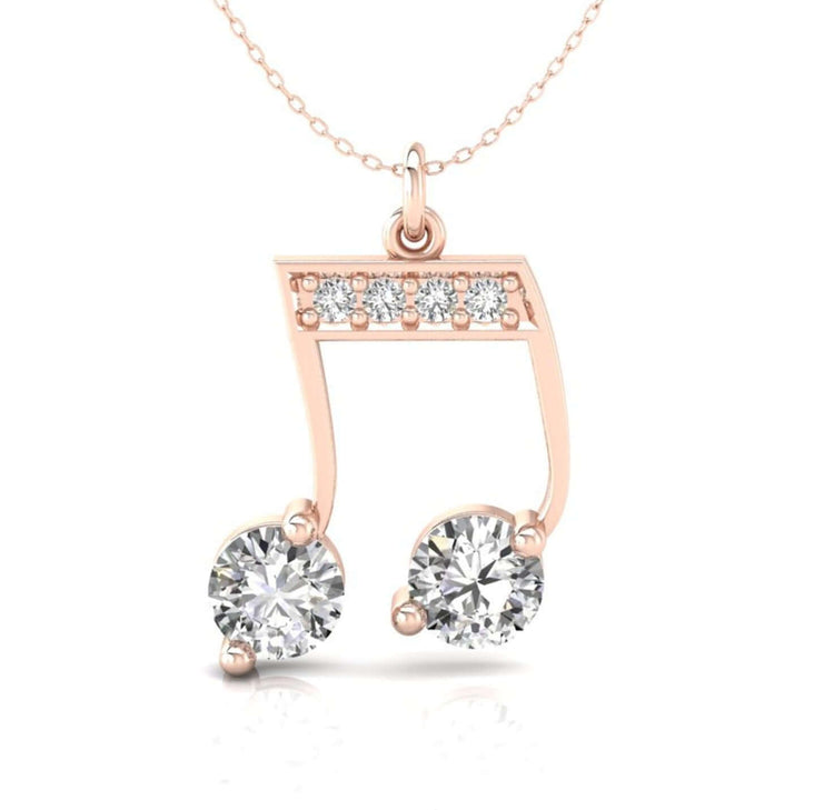 Music note gold pendant with round diamond detail.
