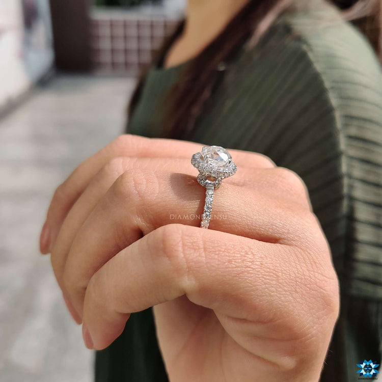 Custom made hidden halo engagement ring in white gold.
