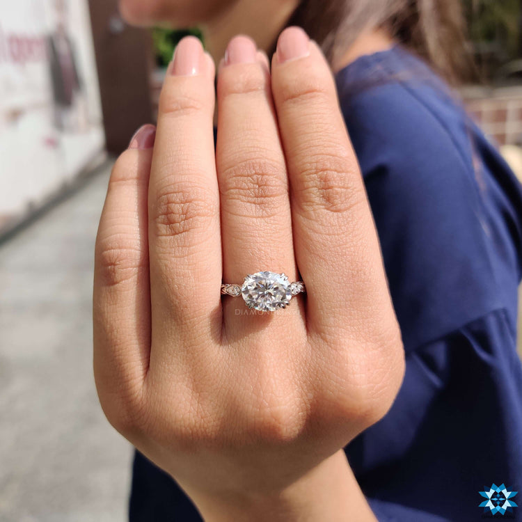 Custom handmade ring with oval center and round cut band design.
