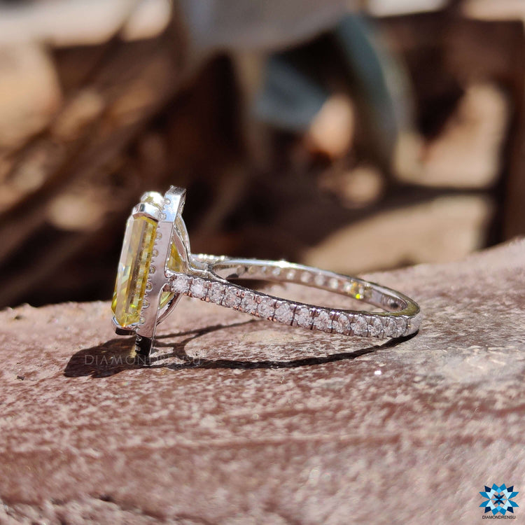 White gold radiant cut ring with round cut pave band.
