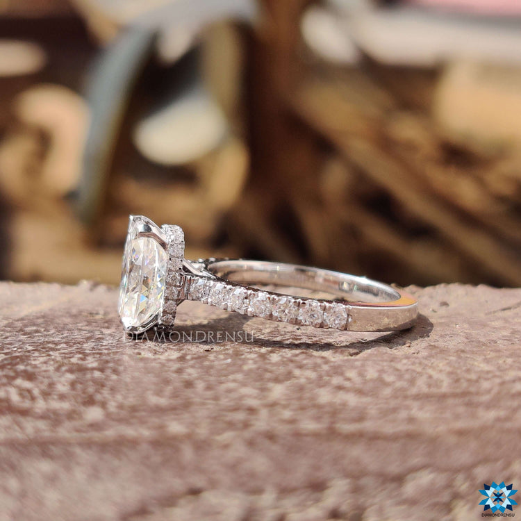 Cathedral setting ring with white gold moissanite.
