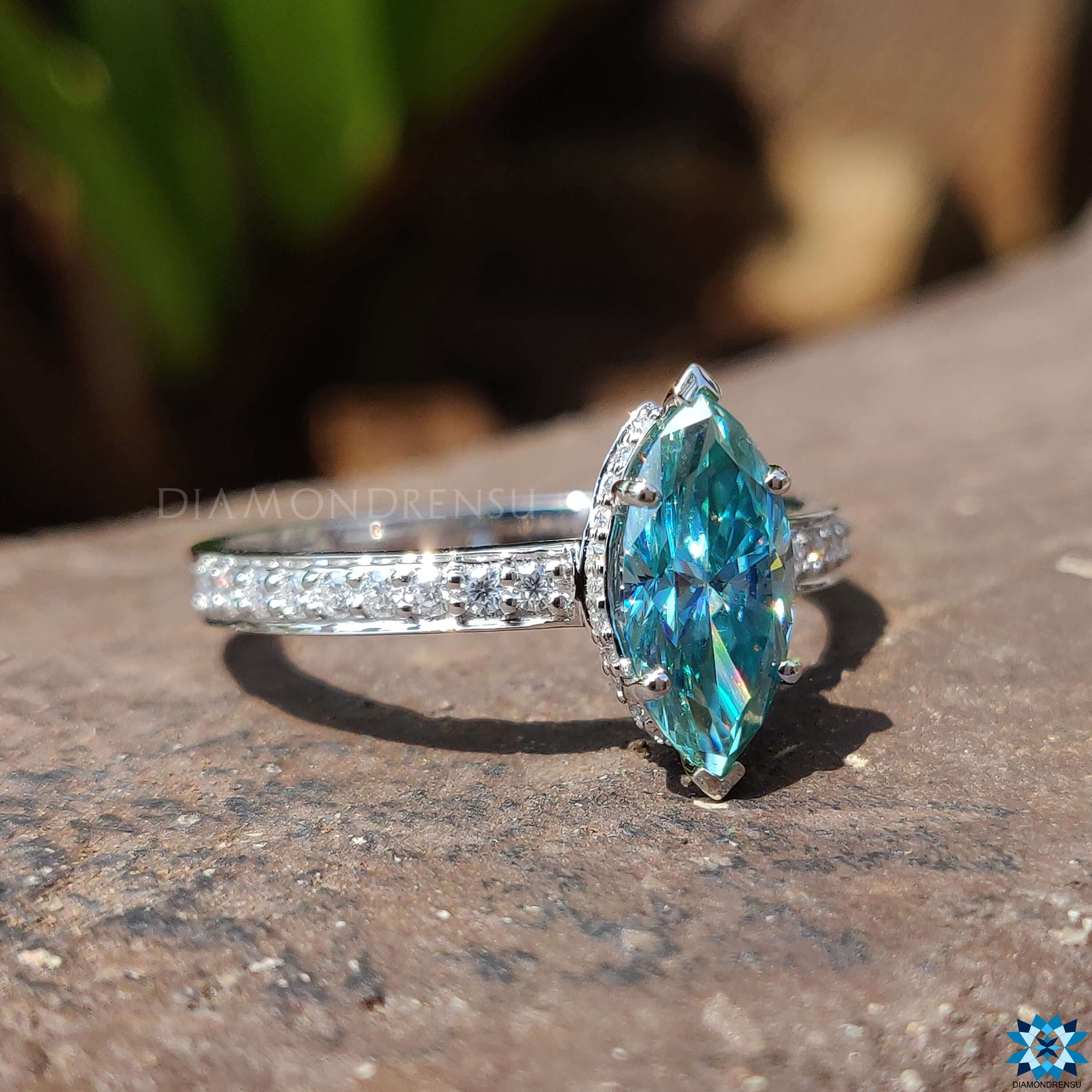 Blue marquise ring with a classic marquise cut engagement ring setting.