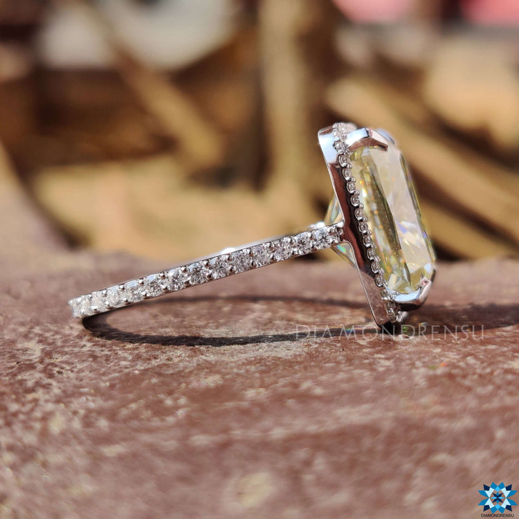 White gold engagement ring with elongated cushion moissanite.

