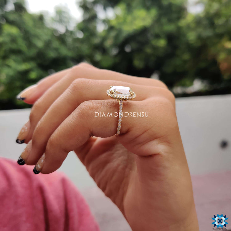 Diamondrensu UK ring with cushion moissanite and pave accents.
