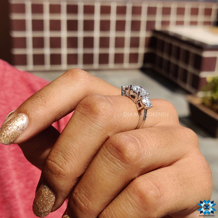 Unique design engagement ring with round cut moissanite.

